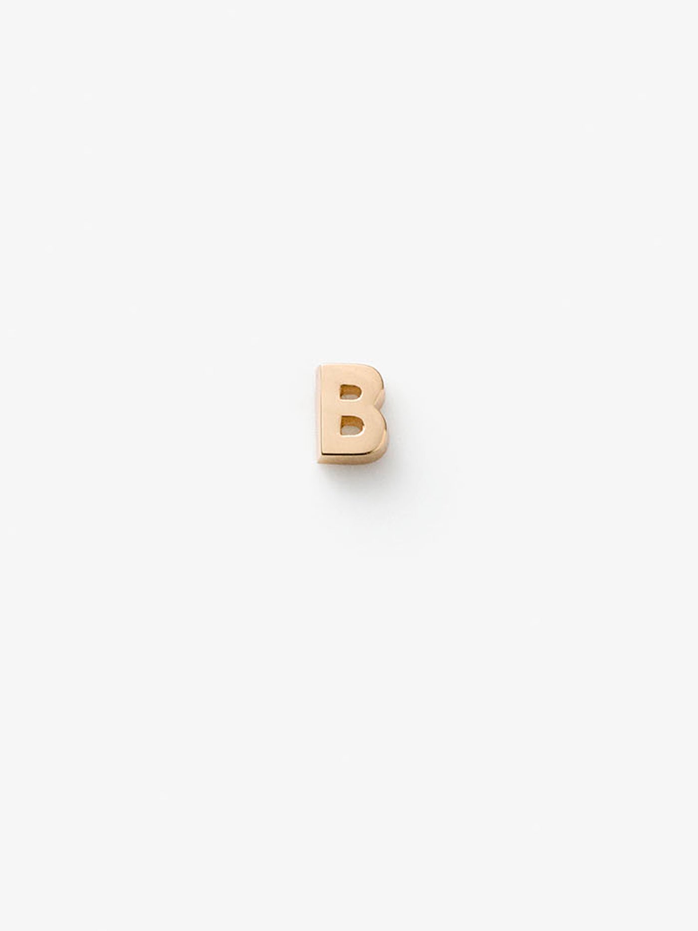 Miniature letter B single stud earring in 18k solid gold with a butterfly fastening for pierced ears. 